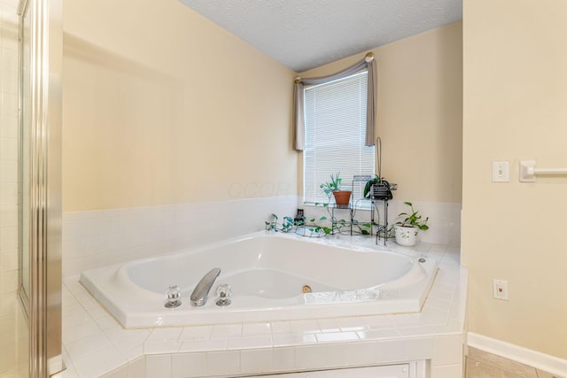 7672 Tullymore Dr, Dublin, OH 43016 - bathroom with a jetted tub and a textured ceiling