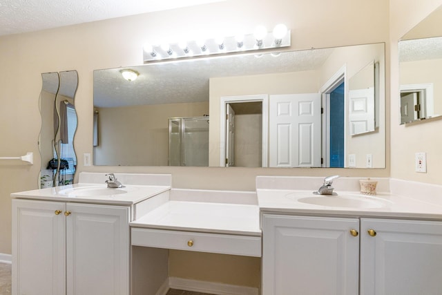 7672 Tullymore Dr, Dublin, OH 43016 - full bathroom featuring double vanity, a stall shower, and a textured ceiling