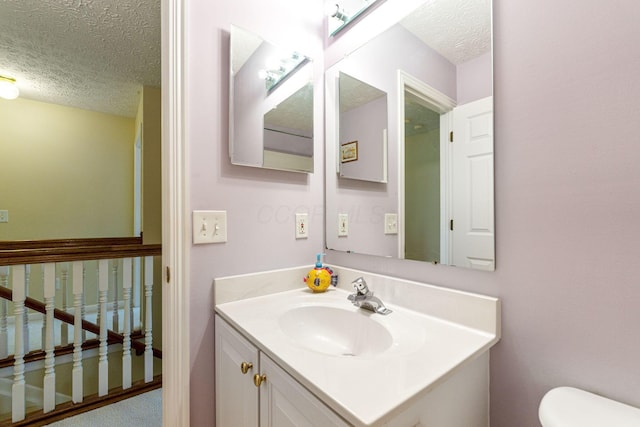 7672 Tullymore Dr, Dublin, OH 43016 - half bathroom with a textured ceiling and vanity