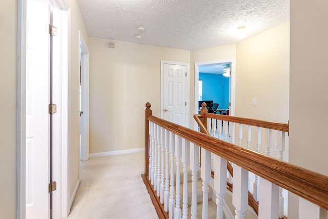 7672 Tullymore Dr, Dublin, OH 43016 - hall featuring an upstairs landing, light colored carpet, and a textured ceiling