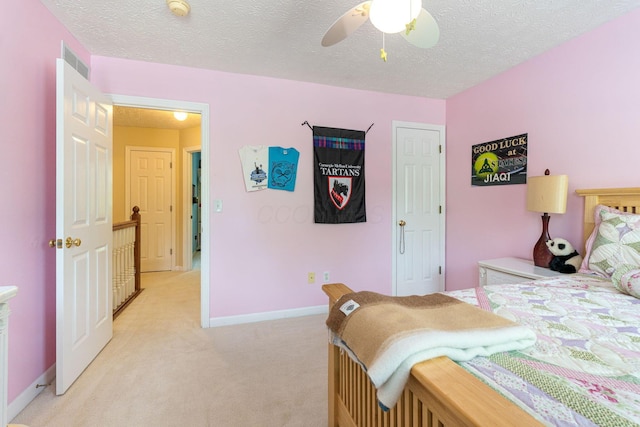 7672 Tullymore Dr, Dublin, OH 43016 - bedroom featuring light carpet, a textured ceiling, and a ceiling fan