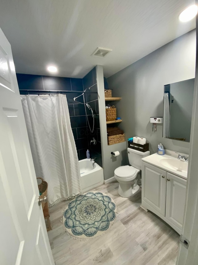2901 Nuway Rd, Columbus, OH 43207 - bathroom with vanity, shower / bath combo, and wood finished floors