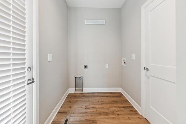 273 S Grubb St S Unit 273, Columbus, OH 43222 - washroom with light wood-style flooring, hookup for an electric dryer, and hookup for a washing machine