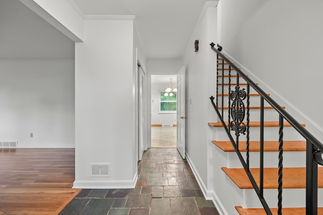 2681 Montcalm Rd, Columbus, OH 43221 - staircase featuring crown molding and stone tile flooring