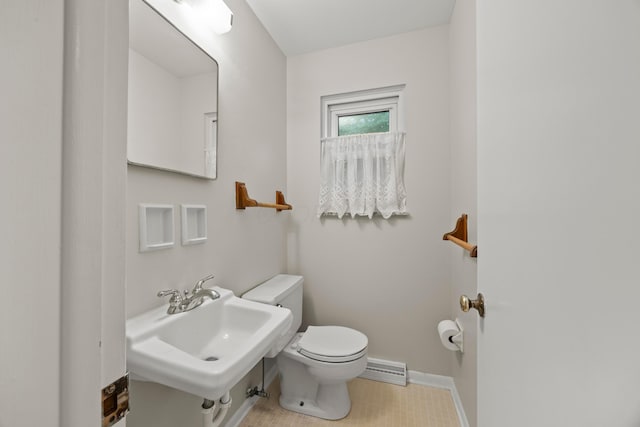 2681 Montcalm Rd, Columbus, OH 43221 - half bath featuring toilet and a baseboard radiator