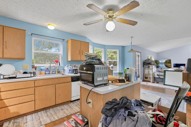 3490 Blendon Bend Way, Columbus, OH 43231 - kitchen featuring light wood-style floors, dishwasher, light countertops, open floor plan, and a textured ceiling