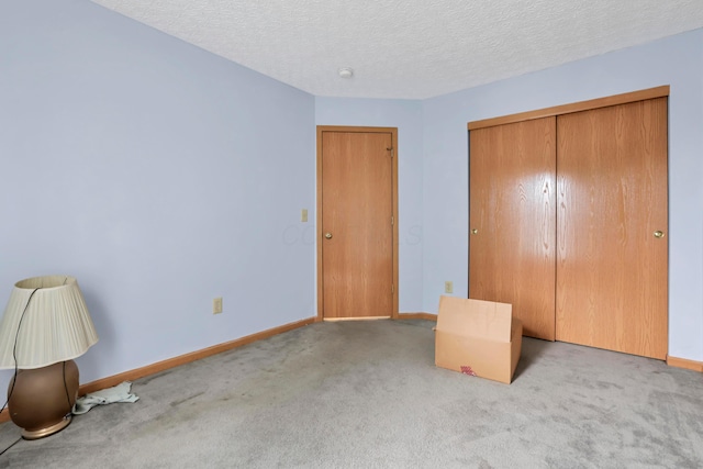 3490 Blendon Bend Way, Columbus, OH 43231 - unfurnished bedroom featuring carpet flooring, a closet, and a textured ceiling