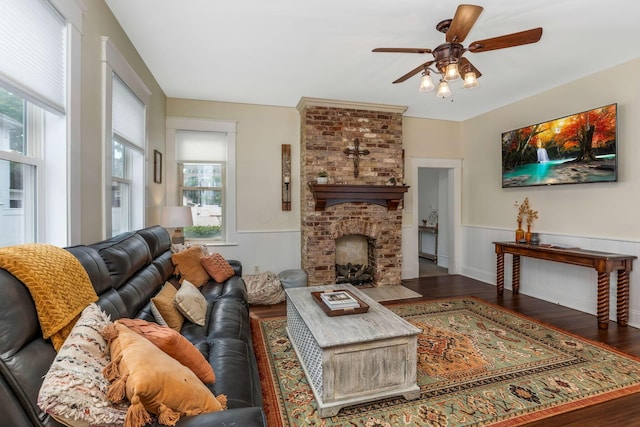 840 N Broad St, Lancaster, OH 43130 - living area with plenty of natural light, a wainscoted wall, ceiling fan, wood finished floors, and a fireplace