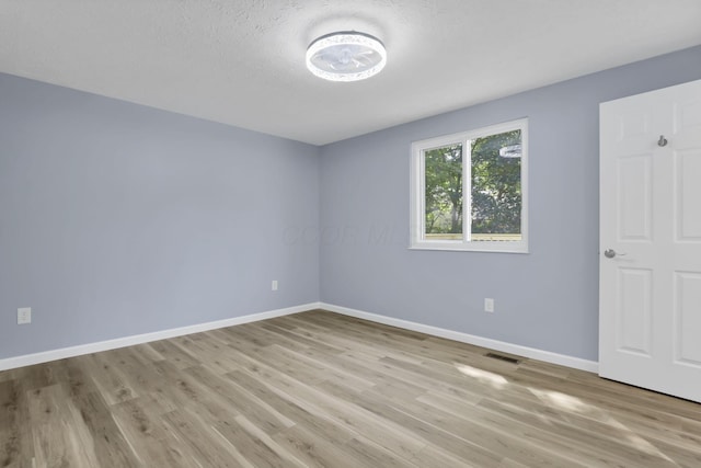 3751 Dolomite Dr, Columbus, OH 43230 - unfurnished bedroom featuring baseboards and wood finished floors