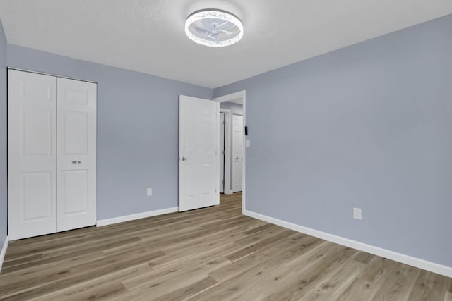 3751 Dolomite Dr, Columbus, OH 43230 - unfurnished bedroom featuring light wood-style flooring and a closet