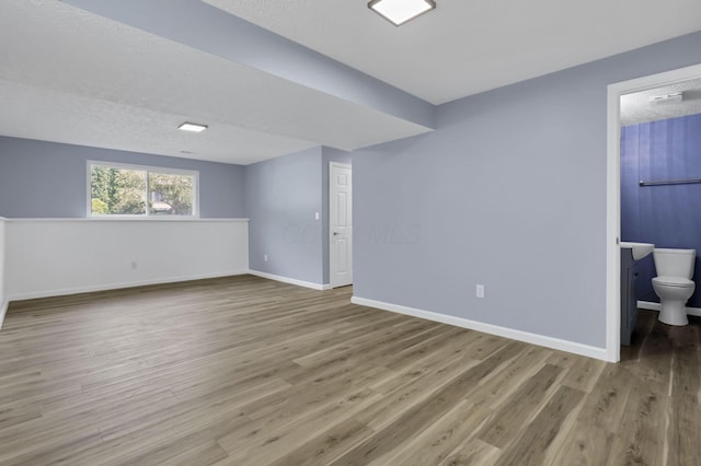 3751 Dolomite Dr, Columbus, OH 43230 - empty room featuring wood finished floors and a textured ceiling