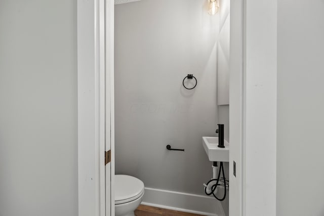 1765 S 8th St, Columbus, OH 43207 - bathroom with toilet and wood finished floors