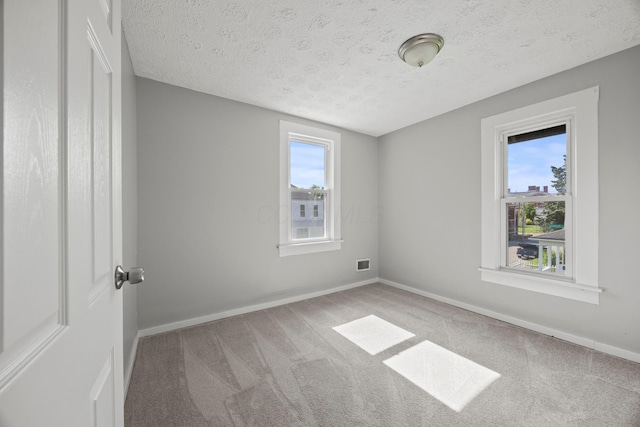 1765 S 8th St, Columbus, OH 43207 - carpeted spare room with a textured ceiling and baseboards