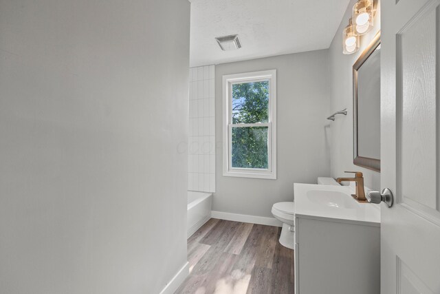 1765 S 8th St, Columbus, OH 43207 - full bathroom featuring vanity, wood finished floors, and shower / bath combination