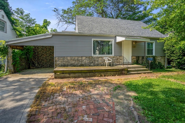 1717 Audrey Rd, Columbus, OH 43224 - view of front of property featuring stone siding, driveway, and a shingled roof