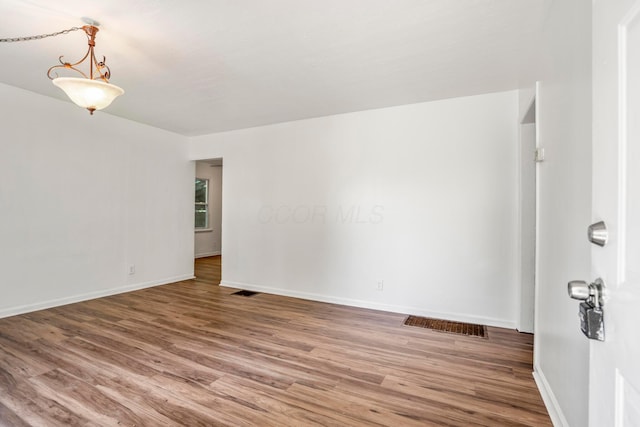 1717 Audrey Rd, Columbus, OH 43224 - empty room with wood finished floors and baseboards