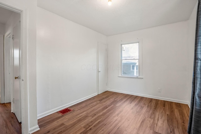 1717 Audrey Rd, Columbus, OH 43224 - spare room with wood finished floors and baseboards