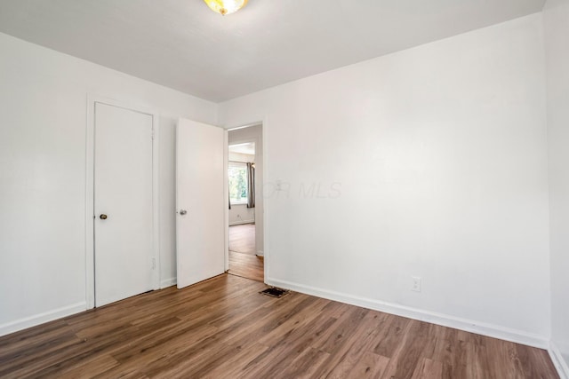1717 Audrey Rd, Columbus, OH 43224 - unfurnished bedroom featuring wood finished floors and baseboards