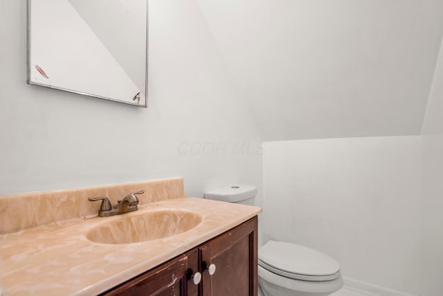 1717 Audrey Rd, Columbus, OH 43224 - bathroom featuring vanity and vaulted ceiling