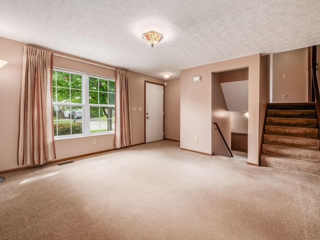 1225 El Toro Dr, Columbus, OH 43204 - carpeted empty room with baseboards and a textured ceiling