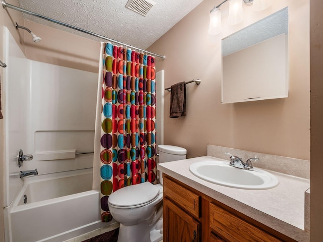 1225 El Toro Dr, Columbus, OH 43204 - bathroom featuring a textured ceiling, vanity, and shower / bath combo