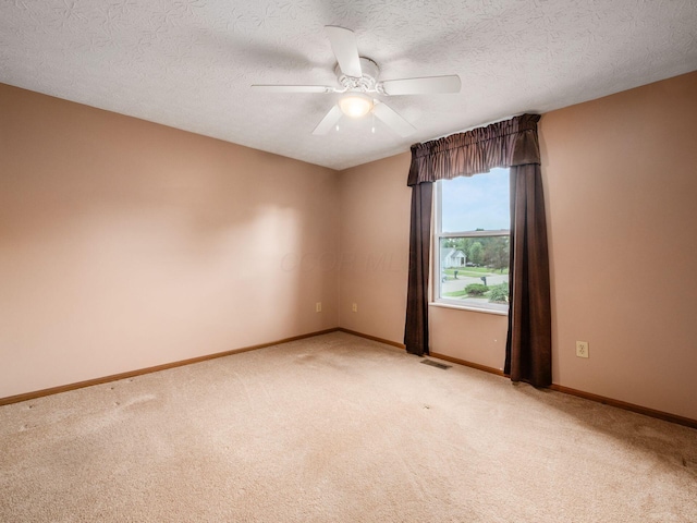 1225 El Toro Dr, Columbus, OH 43204 - unfurnished room with light colored carpet, ceiling fan, and a textured ceiling