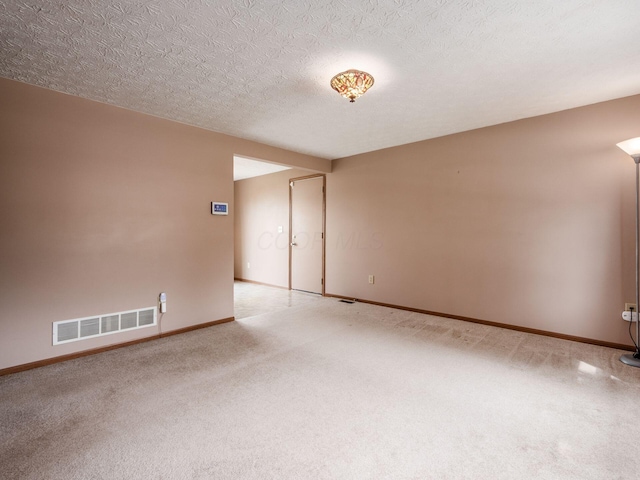 1225 El Toro Dr, Columbus, OH 43204 - carpeted empty room with baseboards and a textured ceiling