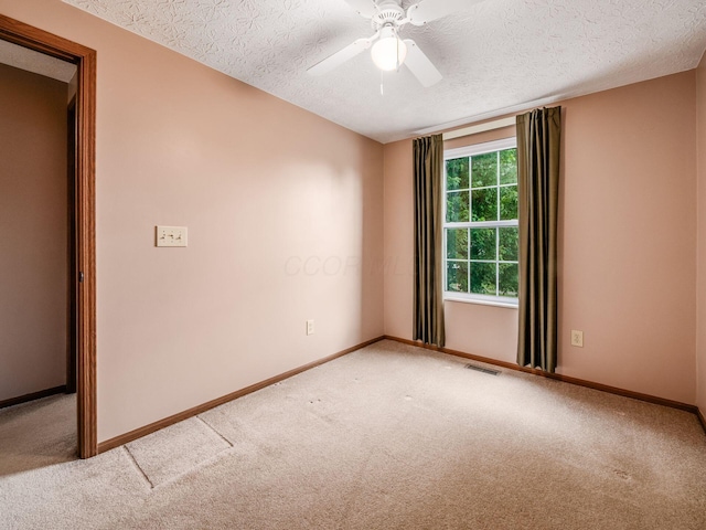1225 El Toro Dr, Columbus, OH 43204 - spare room featuring a textured ceiling, carpet, and ceiling fan