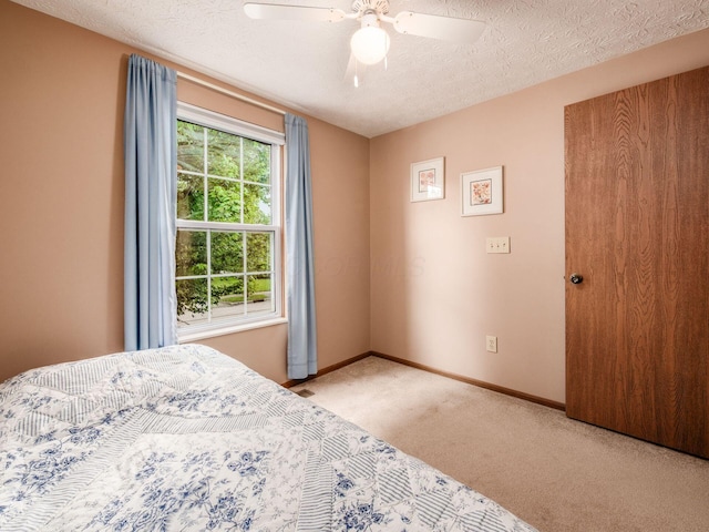 1225 El Toro Dr, Columbus, OH 43204 - carpeted bedroom with a ceiling fan and a textured ceiling