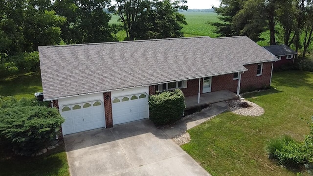 11280 US Highway 23, Lockbourne, OH 43137 - view of front of house featuring brick siding, driveway, a garage, and roof with shingles