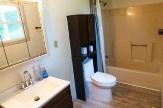 11280 US Highway 23, Lockbourne, OH 43137 - bathroom featuring vanity, bathing tub / shower combination, and wood finished floors
