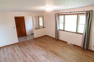11280 US Highway 23, Lockbourne, OH 43137 - empty room with a textured ceiling and light wood finished floors