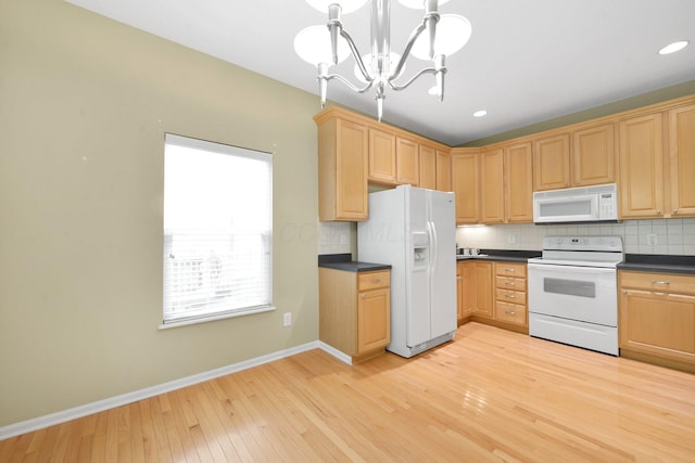 7931 Champaign Dr, Blacklick, OH 43004 - kitchen with white appliances, light wood-style flooring, dark countertops, light brown cabinetry, and recessed lighting