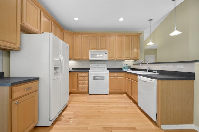 7931 Champaign Dr, Blacklick, OH 43004 - kitchen with white appliances, decorative backsplash, light wood-style floors, dark countertops, and recessed lighting