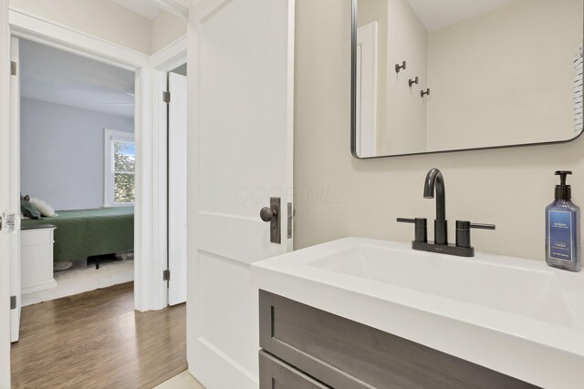 718 Harding Ave, Lancaster, OH 43130 - bathroom with vanity, wood finished floors, and ensuite bath