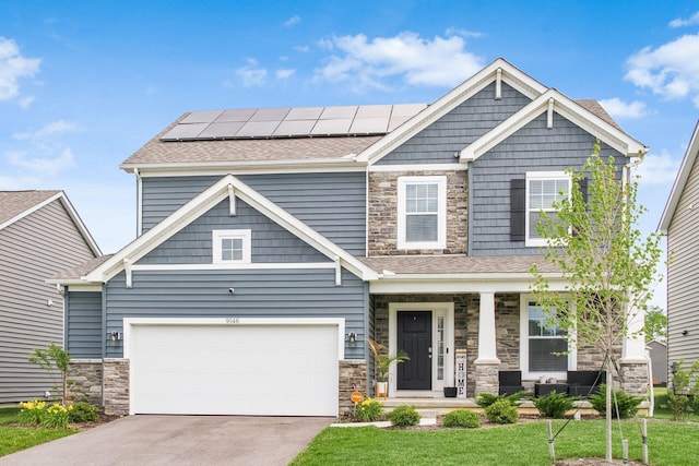 9146 Pennington Way, Blacklick, OH 43004 - craftsman inspired home with covered porch, stone siding, solar panels, and driveway