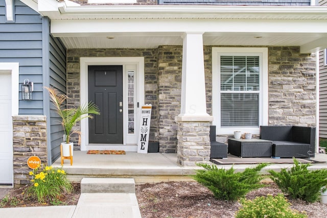 9146 Pennington Way, Blacklick, OH 43004 - doorway to property featuring stone siding and covered porch