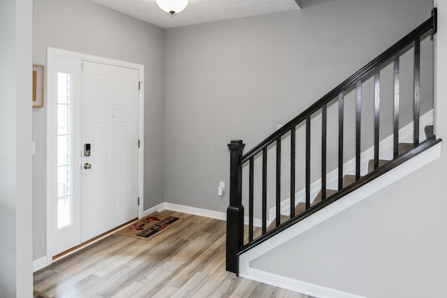 9146 Pennington Way, Blacklick, OH 43004 - entryway featuring wood finished floors and stairs