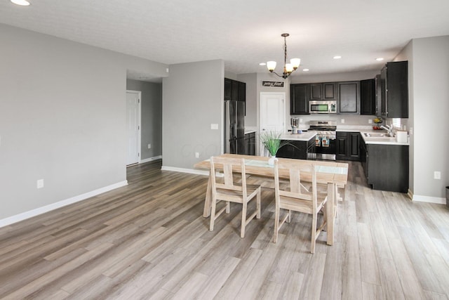 9146 Pennington Way, Blacklick, OH 43004 - dining area with a chandelier, light wood finished floors, and recessed lighting