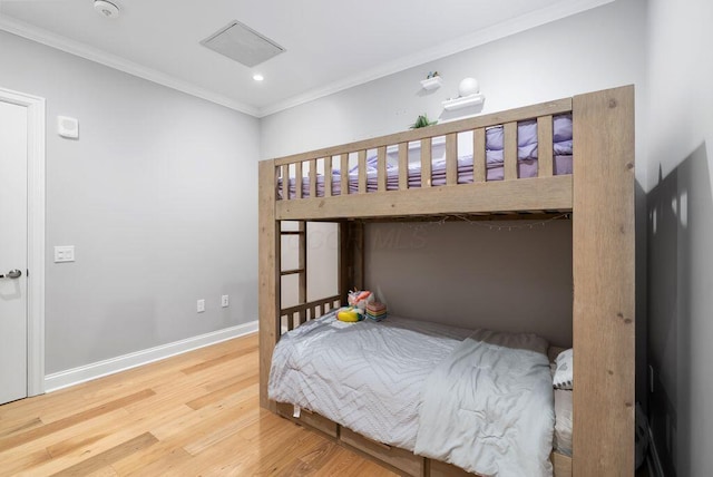 225 John H Mcconnell Blvd Unit 605, Columbus, OH 43215 - bedroom with wood finished floors, crown molding, and recessed lighting