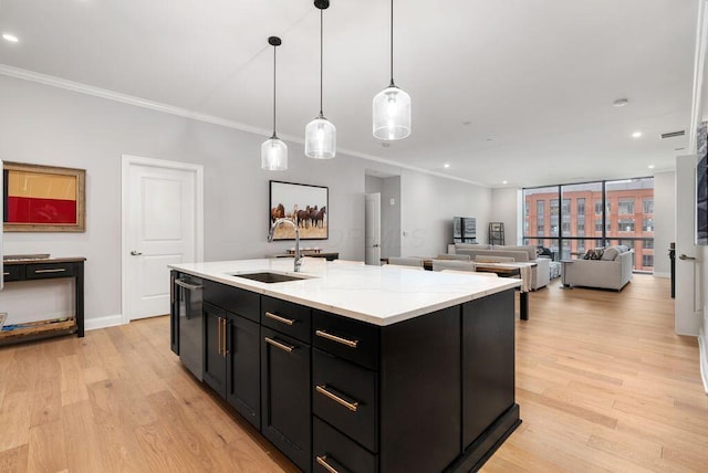 225 John H Mcconnell Blvd Unit 605, Columbus, OH 43215 - kitchen with dark cabinetry, light wood-style floors, ornamental molding, recessed lighting, and stainless steel dishwasher