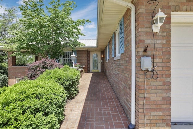 11620 Highland Park, Logan, OH 43138 - view of exterior entry with brick siding and a metal roof