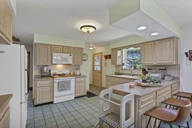 11620 Highland Park, Logan, OH 43138 - kitchen featuring white appliances, light brown cabinetry, backsplash, and recessed lighting