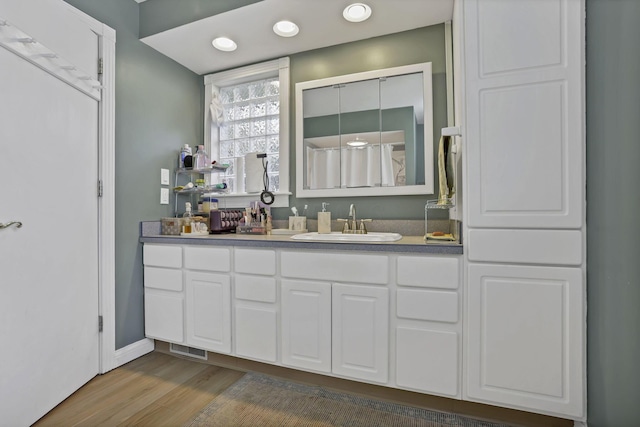 11620 Highland Park, Logan, OH 43138 - full bath with wood finished floors, vanity, and recessed lighting