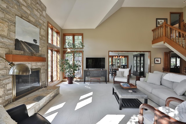 5720 Loch Maree Ct, Dublin, OH 43017 - living area with high vaulted ceiling, a chandelier, carpet flooring, a stone fireplace, and healthy amount of natural light