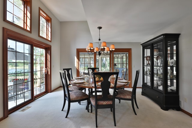 5720 Loch Maree Ct, Dublin, OH 43017 - dining area featuring a chandelier, healthy amount of natural light, and light colored carpet