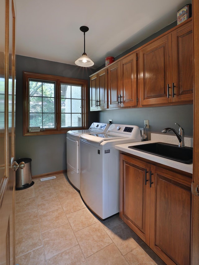 5720 Loch Maree Ct, Dublin, OH 43017 - laundry room featuring cabinet space, independent washer and dryer, and light tile patterned flooring