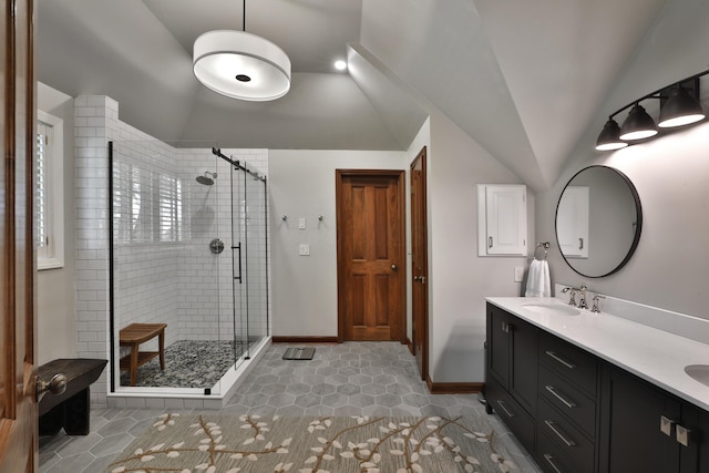 5720 Loch Maree Ct, Dublin, OH 43017 - bathroom with vaulted ceiling, a stall shower, tile patterned flooring, and double vanity