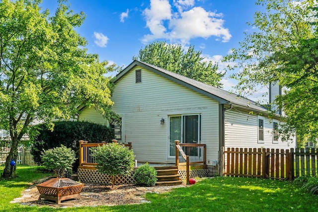 4905 Mckenna Ct, Columbus, OH 43221 - back of property featuring an outdoor fire pit, a deck, and a chimney