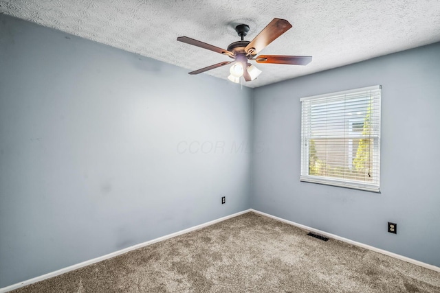 4905 Mckenna Ct, Columbus, OH 43221 - carpeted empty room with a ceiling fan and a textured ceiling